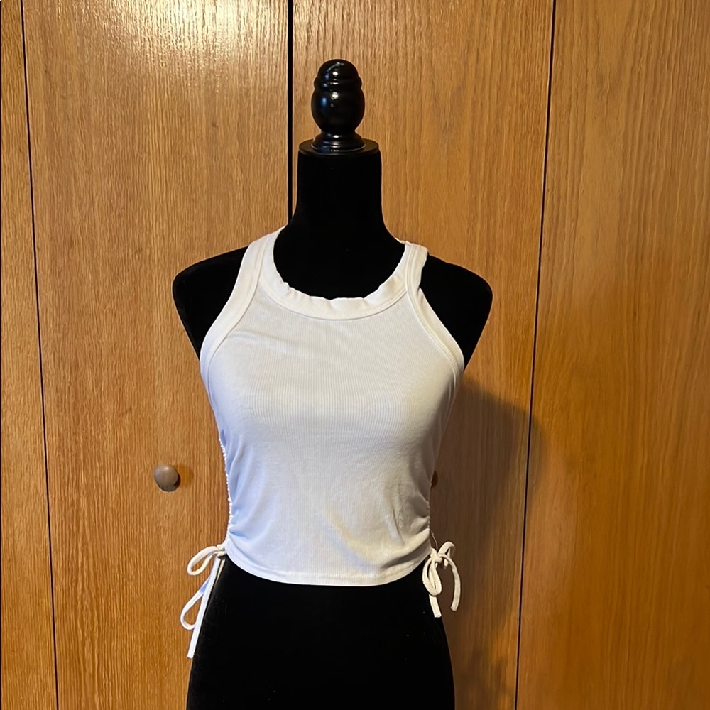 Amable medium white tank top with ruching on sides. Great condition.
